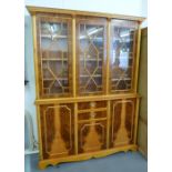 A YEWWOOD LIBRARY BOOKCASE, THE UPPER PORTION ENCLOSED BY THREE ASTRAGAL GLAZED DOORS