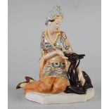 MARCELL GOLDSCHEIDER POTTERY GROUP, modelled as a lady wearing bright floral gown and headdress,