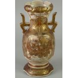 A JAPANESE MEIJI PERIOD KIOTO FAYENCE TWO HANDLED VASE, enamelled and richly gilded autour with