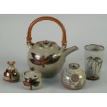 JOHN AND JUDY JELFS, COTSWOLDS POTTERY TEAPOT, with bamboo handle, decorated in a stylized leaf on a