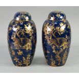 AN ATTRACTIVE PAIR OF CIRCA 1920's WILTSHAW AND ROBINSON CARLTON WARE POTTERY OVOID VASES, with
