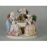 EARLY TWENTIETH CENTURY PROBABLY FRENCH TINTED BISQUE GROUP BE WIGGED AND TWO LADIES IN GOWNS SEATED