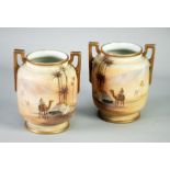 A PAIR OF 1930's JAPANESE NORITAKE PORCELAIN TWO HANDLED VASES, each enamelled with an encircling
