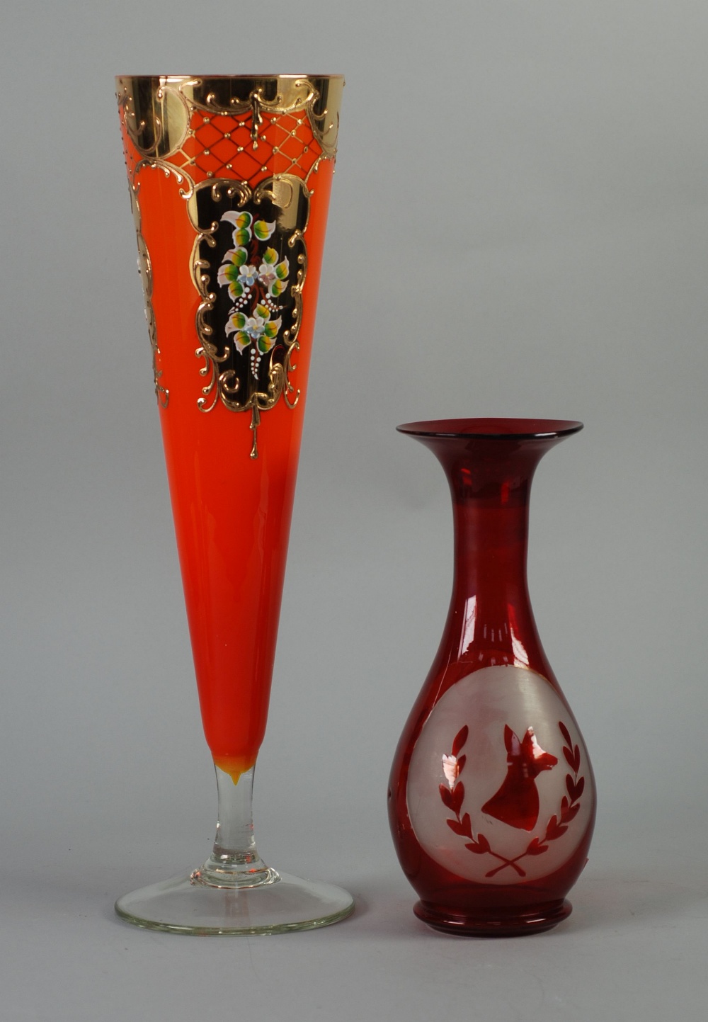 AUSTRIAN RUBY STAINED GLASS VASE, of footed ovoid form with tall, waisted neck, decorated with two