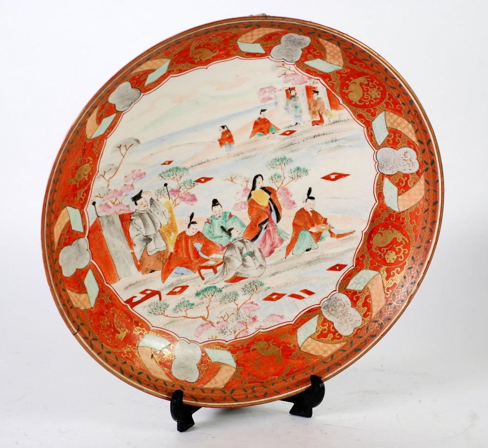 LARGE JAPANESE KUTANI DISHED PLAQUE, decorated with male and female figures in a landscape, 14" (