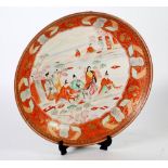 LARGE JAPANESE KUTANI DISHED PLAQUE, decorated with male and female figures in a landscape, 14" (