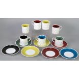 SEVEN SUSIE COOPER DESIGN CHINA COFFEE CANS AND SAUCERS, 'Stellate Pattern' viz maroon x 2, yellow x