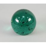 VICTORIAN GREEN BUBBLE GLASS LARGE DUMP DOOR STOP, of typical form with tear inclusion, 5" (12.