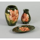 THREE PIECES OF WALTER MOORCROFT TUBE LINED POTTERY in the Hibiscus design, comprising; OVOID