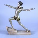 ART DECO SILVER PATINATED SPELTER FIGURE OF A FEMALE DANCER, modelled in stylized pose on a stepped,