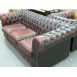 A THREE SEATER CHESTERFIELD SETTEE IN OXBLOOD RED