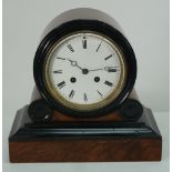 LATE NINETEENTH CENTURY WALNUTWOOD AND EBONISED SMALL DRUM TOP MANTEL CLOCK, the 4 1/2" enamelled