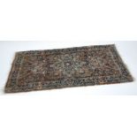 SEMI ANTIQUE PERSIAN RUG, with large petal form centre medallion and large pendants on a brown field