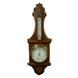 EDWARDIAN CARVED OAK ANEROID BAROMETER, the 8" diameter, set beneath a mercury thermometer to the