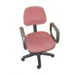 A REVOLVING OFFICE ARMCHAIR