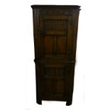 A TWENTIETH CENTURY 'JACOBEAN REVIVAL' FLOOR STANDING CORNER CUPBOARD