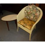 A WHITE LOOM TUB ARMCHAIR AND A 1960's OVAL COFFEE TABLE WITH FORMICA TOP