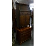 A 1930's OAK SLOPE FRONT DESK, TOGETHER WITH A REPRODUCTION YEW TREE WOOD CHEST OF DRAWERS (2)