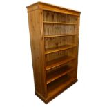 A LARGE PINE SHELVING UNIT WITH FOUR ADJUSTABLE SHELVES (197cm high x 126cm wide)