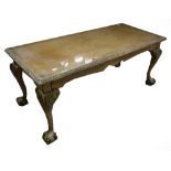 A FIGURED AND CARVED WALNUTWOOD LONG OBLONG COFFEE TABLE WITH GLASS PROTECTOR, ACANTHUS CARVED