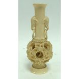 JAPANESE LATE MEIJI PERIOD CARVED IVORY TWO-HANDLED VASE with concentric ball to the base, of footed