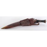 A WORLD WAR II PERIOD GURKHA KNIFE in leather sheath with the subsidiary knives