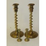 PAIR OF BRASS CANDLESTICKS, ON BARLEY TWIST STEMS AND TWO SMALL EXAMPLES (4)