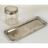 GEORGE V ENGINE TURNED SILVER DRESSING TABLE TRAY of rounded oblong form, 8 1/2" x 3 1/4" (21.6cm