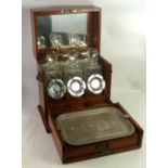 LATE VICTORIAN OAK TANTALUS BOX, with hinged lid with interior mirror, fall front fitted with a