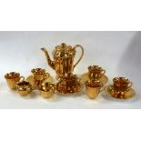 A WADE ALL GILT CHINA PART COFFEE SET OF 14 PIECES (ONE SAUCER MISSING)