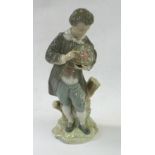 LLADRO FIGURE, BOY IN PERIOD COSTUME WITH HAT FULL OF FLOWERS, 10 1/2" HIGH