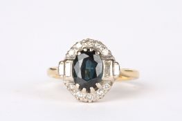 An 18ct gold, green sapphire and diamond cluster ringset with oval cut central stone flanked by