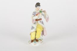 A late 20th century Meissen figureafter Elias Meyer, modelled as a seated Japanese lady feeding