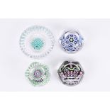 Three Whitefriars facetted glass millefiori paperweights
including a 25th jubilee paperweight, two