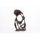 A Tribal African wooden carving of a mother feeding child
late 19th, early 20th Century, height