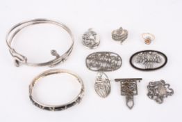 A collection of Art Deco and later silver jewellery including a silver coiled twin snake arm bangle,