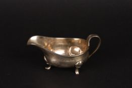 A George III silver sauce boathallmarked London 1797, of plain boat shaped form with scrolled