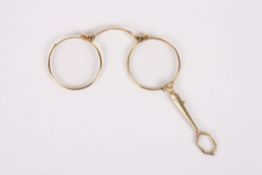 A late 19th century gilt metal lorgnettewith push button mechanism opening the lorgnette, with