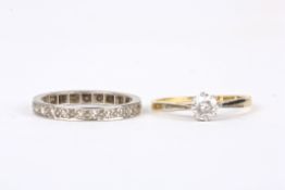 An 18ct gold, platinum and diamond solitaire ringset with stone weighing approx. 0.25cts,