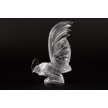 A modern Lalique 'Coq Nain' clear glass car mascot
the cockerel with tail raised and resting on a