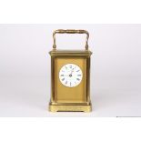 A late 19th century gilt brass carriage clock timepiece
the circular white enamel dial signed