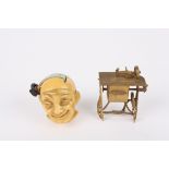 Two novelty tape measures
the first in the form of a Victorian treadle sewing machine, the second