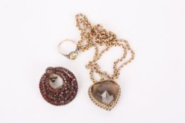 A large gold mounted gem set heart shaped pendanton a long 9ct chain, together with a Victorian