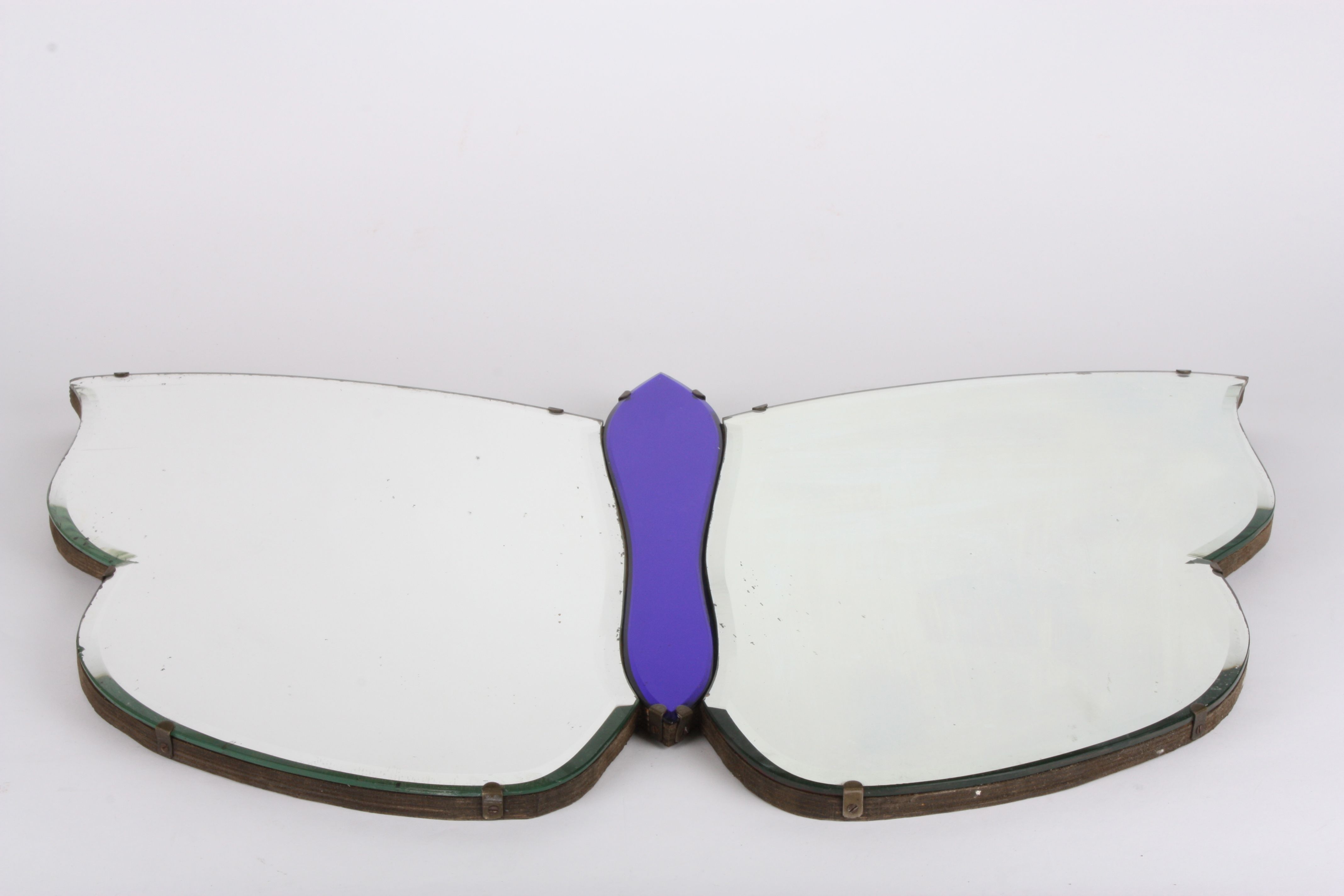 A vintage mirror in the form of a Butterfly
with bevelled edge, width 74cm, height 47cmCondition: - Image 2 of 2