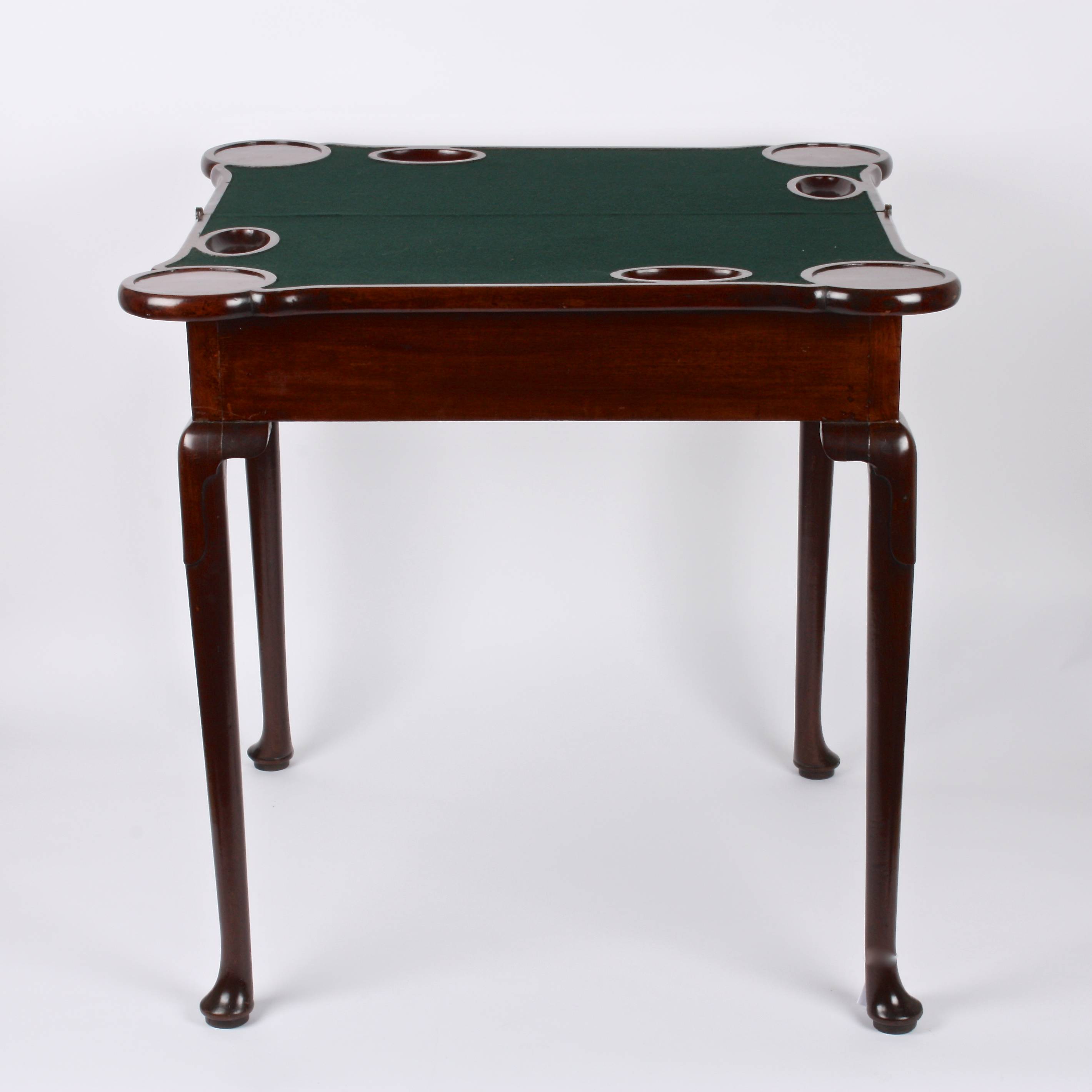 A George II mahogany foldover card table
the shaped top opening to reveal circular carved trays - Image 2 of 3