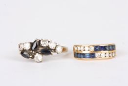 Two gold, sapphire and diamond ringsone set with two rows of alternating channel set diamonds and