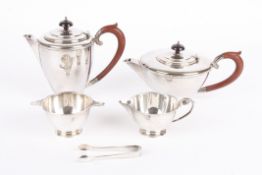 A two piece silver tea sethallmarked Birmingham 1949, comprising teapot and hot water jug, with