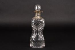 An Edwardian silver mounted glass decanter and stopperhallmarked London 1907, with wrythen