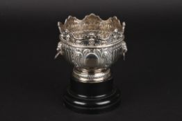 A small Victorian embossed rose bowlhallmarked London 1899, with scrolled mask moulded rim, semi-