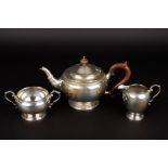 A George V silver three piece tea set
hallmarked Birmingham 1924, comprising teapot, milk jug and